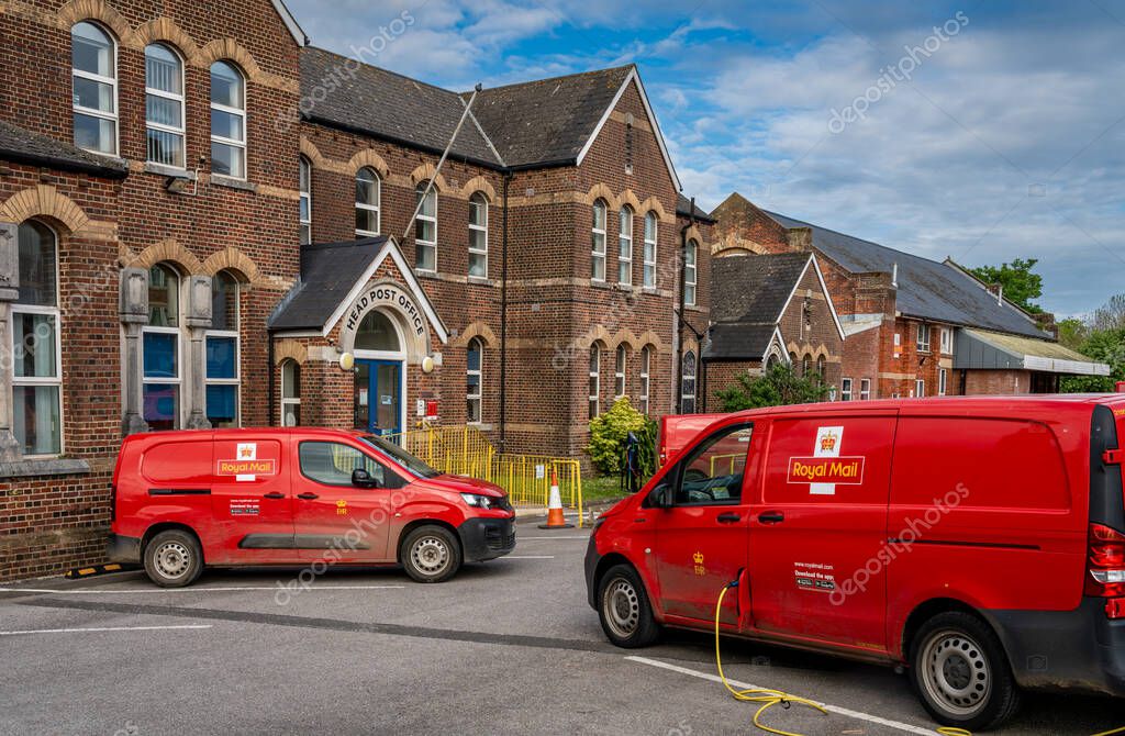 Dorchester, United Kingdom, 15.05.2024, Exterior of Royal Mail Delivery Office with parked postal vans