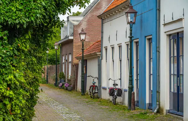 stock image Bikes parked in picturesque dutch cobbled street in Wijk bij Duurstede