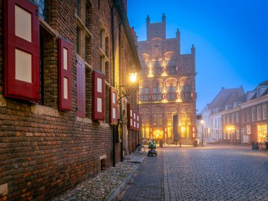 Doesburg in the evening, former town hall and the historical weigh house clipart