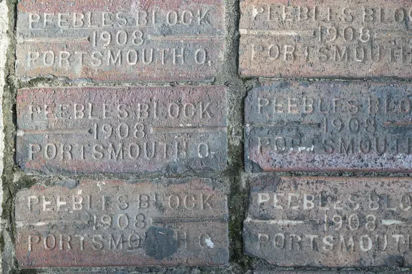 stock image Johnson City, TN.  July 27, 2024. City of Johnson City, TN USA.  1908 Peebles Block Portsmouth Ohio.  Details of vintage brick in the sidewalk.