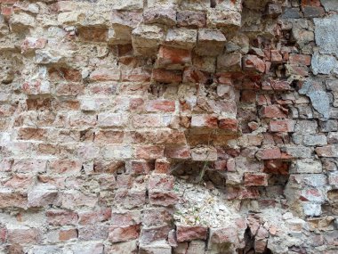Tuğla desenli fotoğraf. Kırık taş duvar. Tuğla dokusu. Tuğla dokusu arkaplanı.