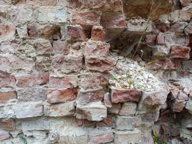 Tuğla desenli fotoğraf. Kırık taş duvar. Tuğla dokusu. Tuğla dokusu arkaplanı.