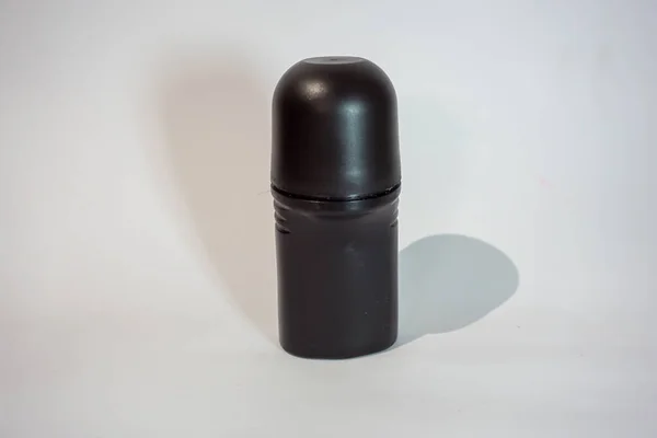 Desodorante Botella Negro Con Fondo Blanco Sombra Negra —  Fotos de Stock