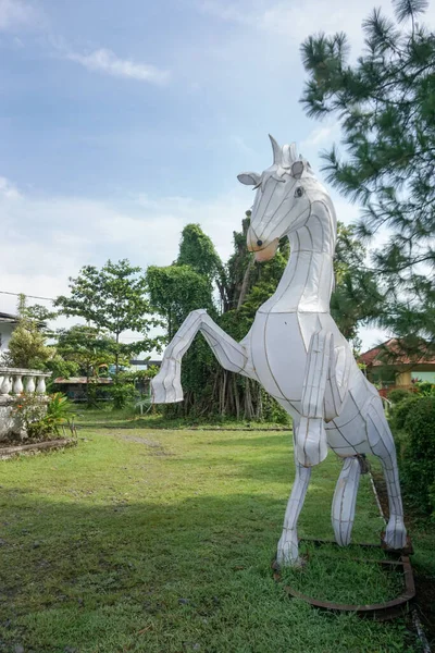 stock image Central Java, Indonesia - 03 05 2023: white horse doll becomes a beautiful decoration in the park