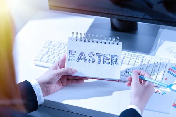 Hand writing sign Easter, Business approach holiday commemorating the resurrection of Jesus from the dead