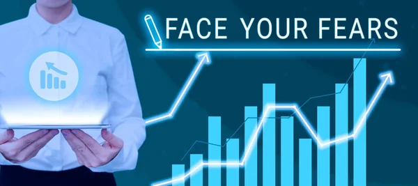 Conceptual caption Face Your Fears, Word for Strong and confident to look into the future to success Woman With Tablet Presenting Digital Bar Graph And Business Growth.