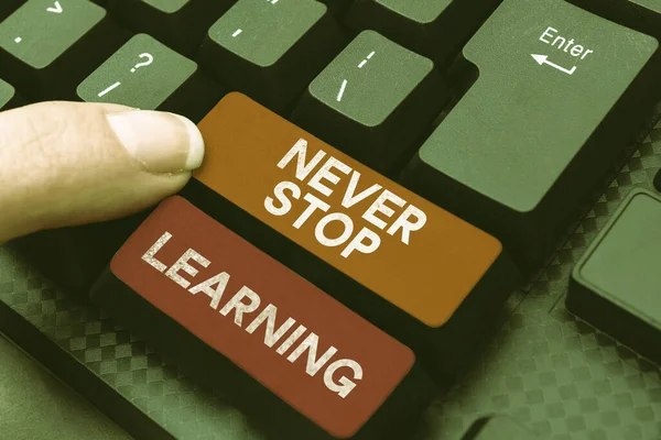 Stock image Text caption presenting Never Stop Learning, Internet Concept continuous education and techniques to be competitive