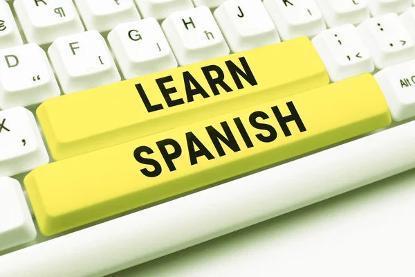 stock image Hand writing sign Learn Spanish, Word Written on to train writing and speaking the national language of Spain