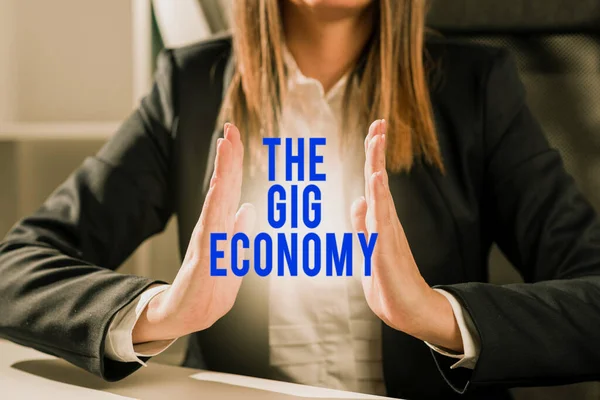 Conceptual caption The Gig Economy, Word for Market of Short-term contracts freelance work temporary