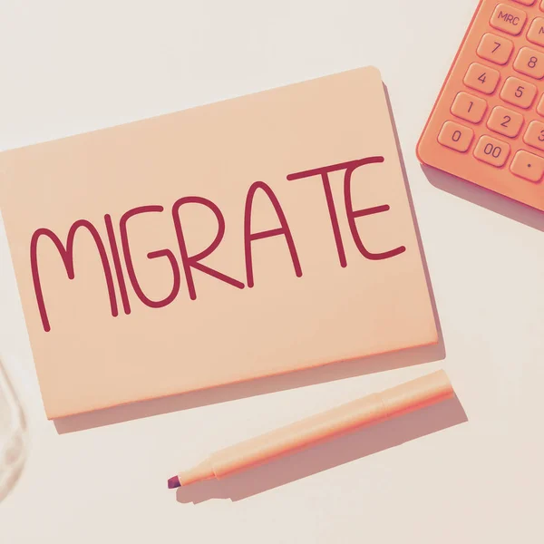 stock image Hand writing sign Migrate, Business overview to move or travel from one country place or locality to another