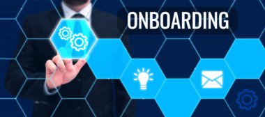 Yeni bir çalışanı bir organizasyona entegre etmenin eylem süreci anlamına gelen el yazısı içeriyor.