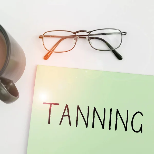 Sign displaying Tanning, Business overview a natural darkening of the scin tissues after exposure to the sun