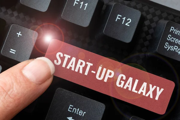 Writing displaying text Start Up Galaxy, Business showcase Newly emerged business created by new entrepreneurs