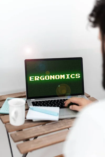 Conceptual caption Ergonomics, Concept meaning fitting or designing a workplace to the users needs