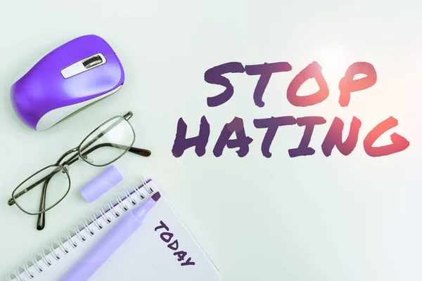 Sign displaying Stop Hating, Word Written on cease hostility and aversion deriving from fear, anger, or sense of injury