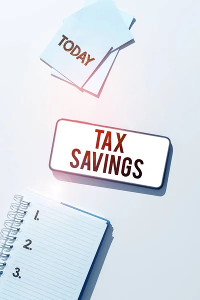 Conceptual caption Tax Savings, Internet Concept only a portion of income is taxable Pay a reduced amount of tax