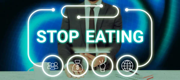 Text sign showing Stop Eating, Business concept cease the activity of putting or taking food into the mouth
