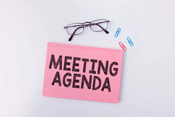 Sign displaying Meeting Agenda, Word Written on An agenda sets clear expectations for what needs to a meeting
