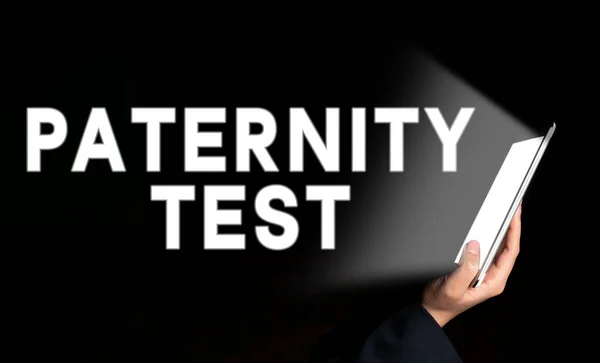 Writing displaying text Paternity Test, Word Written on a test of DNA to determine whether a given man is the biological father