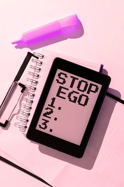 Hand writing sign Stop Ego, Conceptual photo Control your obsession about a decision or an event or anything