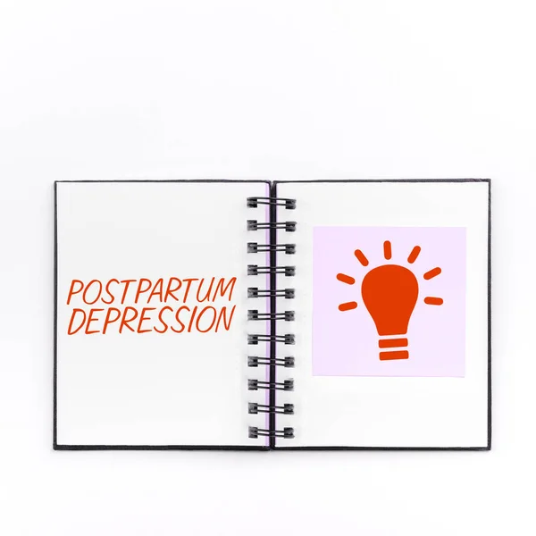 Sign displaying Postpartum Depression, Word for a mood disorder involving intense depression after giving birth