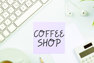 El yazısı, kahve dükkanı, iş vitrininde kahve ve hafif içecek servisi yapan küçük bir restoran.
