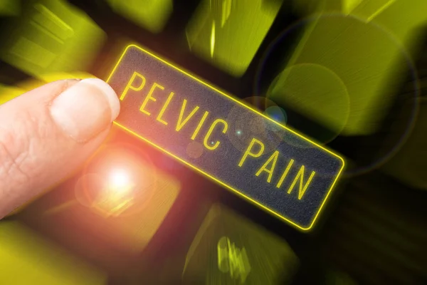 Hand writing sign Pelvic Pain, Business approach Pain perceived in the area of the lower part of the abdomen