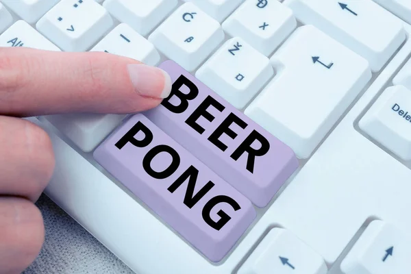Writing displaying text Beer Pong, Word Written on a game with a set of beer-containing cups and bouncing or tossing a Ping-Pong ball