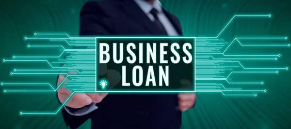 Hand writing sign Business Loan, Business concept Credit Mortgage Financial Assistance Cash Advances Debt