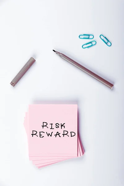 stock image Text sign showing Risk Reward, Business overview assess the profit potential of a trade relative to its loss