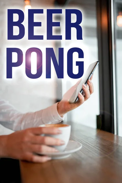 Conceptual caption Beer Pong, Business concept a game with a set of beer-containing cups and bouncing or tossing a Ping-Pong ball