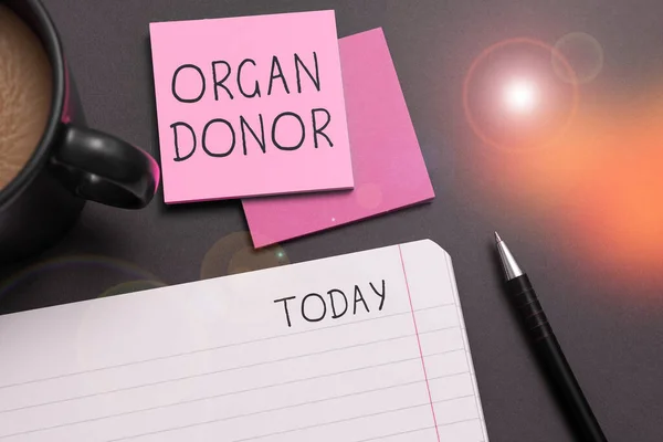 Text sign showing Organ Donor, Word for A person who offers an organ from their body for transplantation