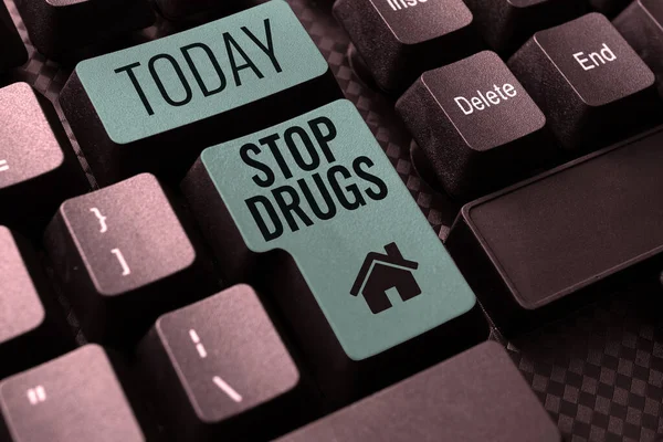 Writing displaying text Stop Drugs, Word for put an end on dependence on substances such as heroin or cocaine