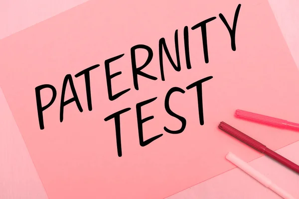 Hand writing sign Paternity Test, Business showcase a test of DNA to determine whether a given man is the biological father