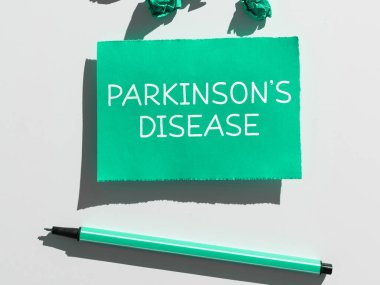 Parkinson Hastalıkları, iş konsepti sinir sistemi bozukluğunun hareketi ve bilişsel yetenekleri etkilediğini gösteren metin işareti