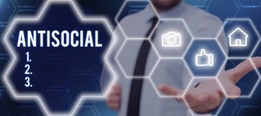 Writing displaying text Antisocial, Business concept hostile or harmful to organized society being marked deviating