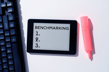 Hand writing sign Benchmarking, Word Written on Evaluate something by comparison with a standard Strategy