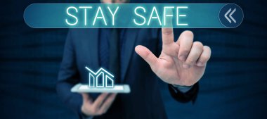 Satır başlığı Stay Safe, iş konsepti tehlike, zarar veya haber saklama tehdidinden korunuyor