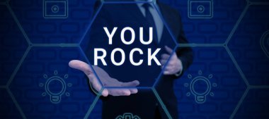 Text sign showing You Rock, Concept meaning slang phrase of praise or encouragement conveying you are awesome