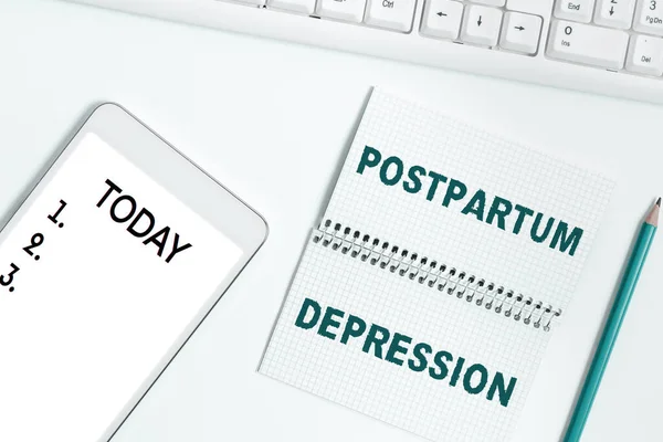 Sign displaying Postpartum Depression, Word Written on a mood disorder involving intense depression after giving birth