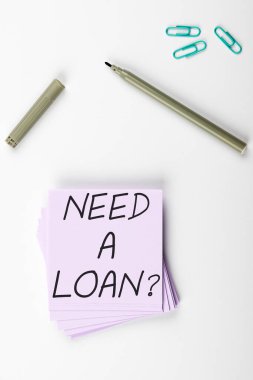Writing displaying text Need A Loan, Word for amount of money that is borrowed often from bank