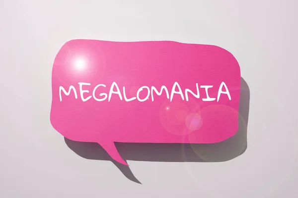 手写体符号Megalomania 一种以个人全能感为特征的精神疾病 — 图库照片