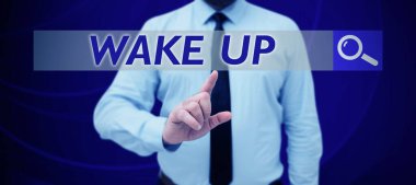 Text sign showing Wake Up, Word Written on an instance of a person waking up or being woken up Rise up