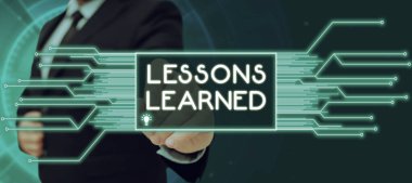 Sign displaying Lessons Learned, Internet Concept Promote share and use knowledge derived from experience