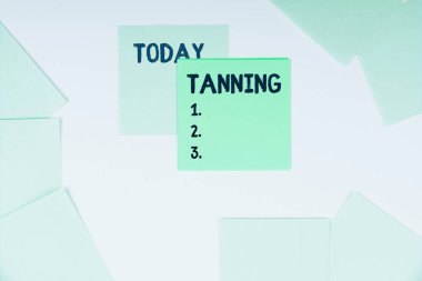 Conceptual display Tanning, Business idea a natural darkening of the scin tissues after exposure to the sun