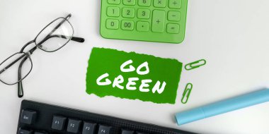 Text caption presenting Go Green, Business approach making more environmentally friendly decisions as reduce recycle