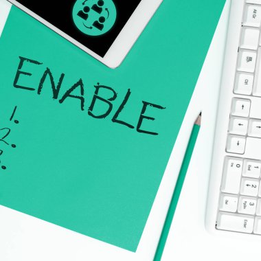 Writing displaying text Enable, Concept meaning give someone or something the authority or means to do something