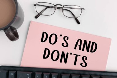 Hand writing sign Dos And Don Ts, Business concept Confusion in ones mind about something