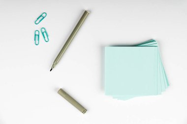 Notebook and Colored Papers Stickers Lying On Desk. Collection Stationery.