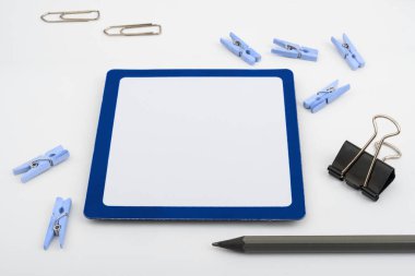 Important Messages. Sticker Lying On White Desk With Clotherspins.